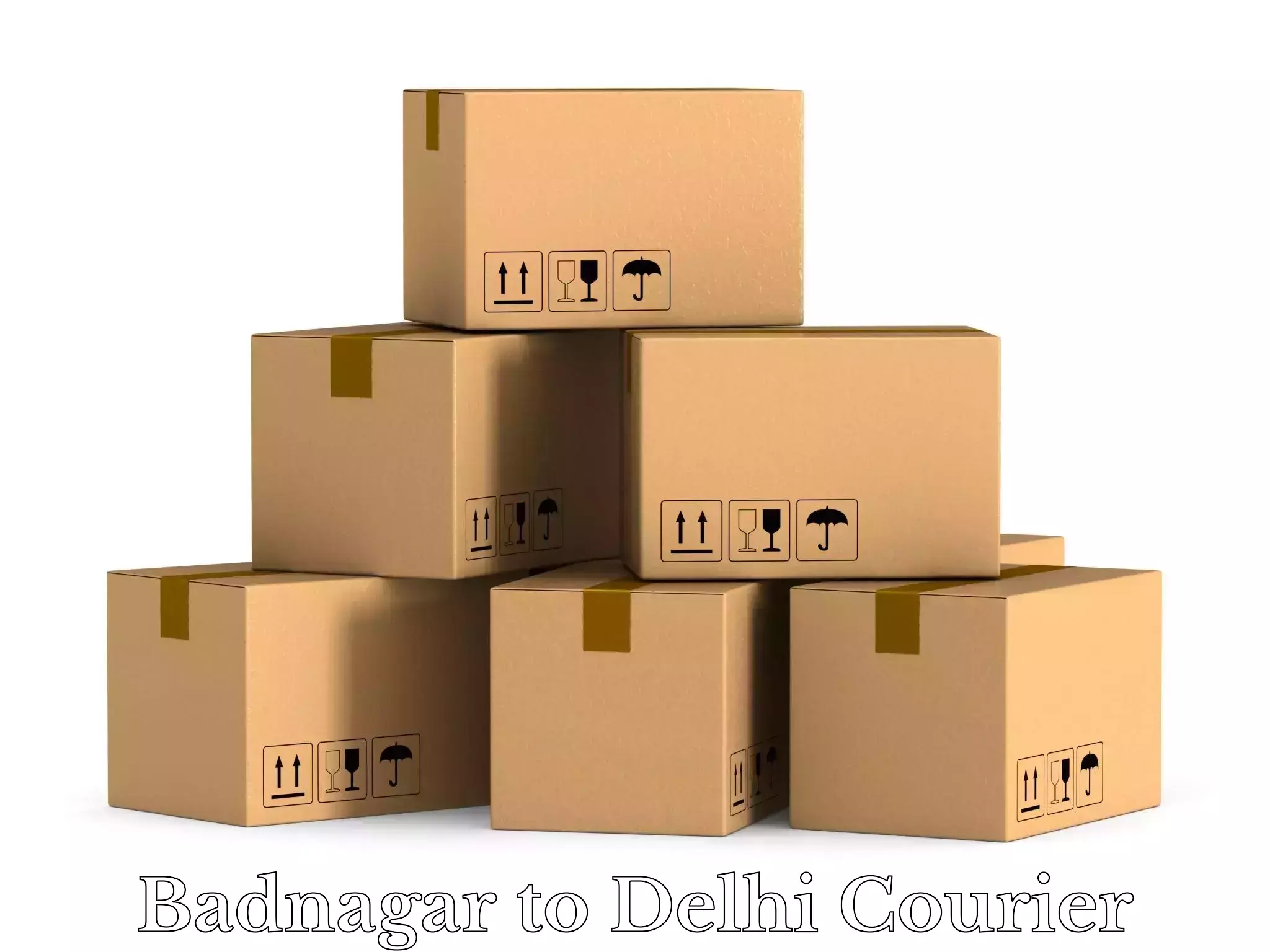 Round trip baggage courier Badnagar to Jamia Millia Islamia New Delhi