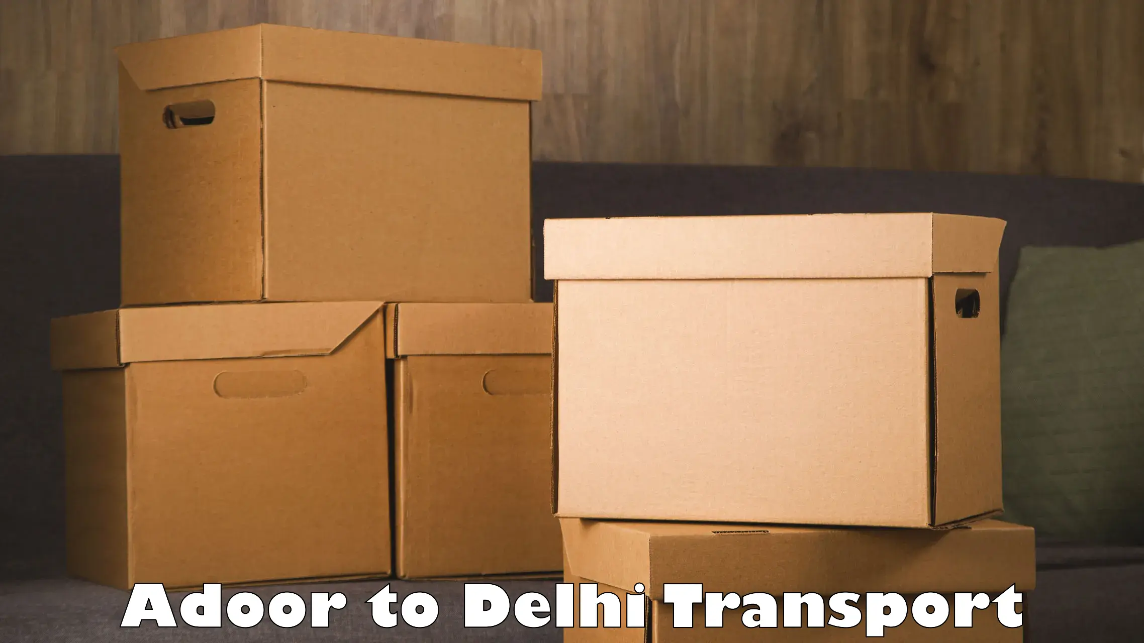 Road transport services Adoor to East Delhi